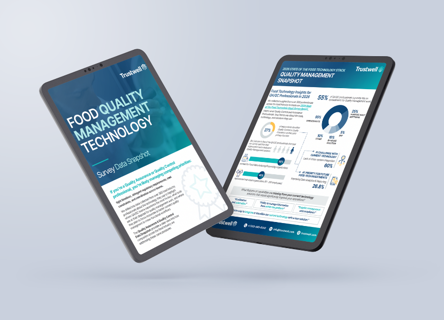 Two tablets with food quality management data snapshot onscreen