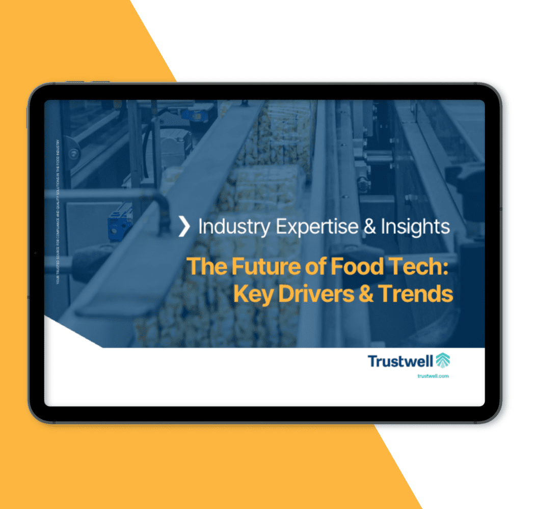 Tablet displaying an ebook titled "The Future of Food Tech: Key Drivers & Trends" by Trustwell, featuring an image of a food production line.