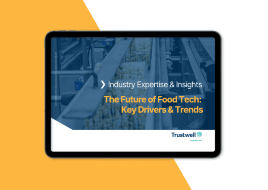 Tablet displaying an ebook titled "The Future of Food Tech: Key Drivers & Trends" by Trustwell, featuring an image of a food production line.